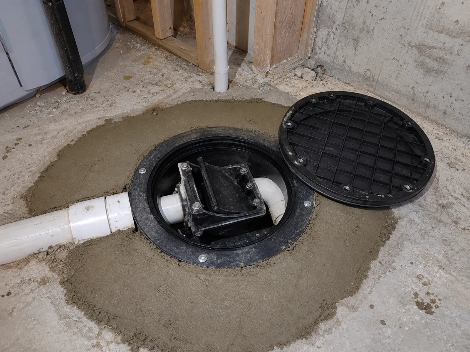 A new backwater valve installed in a basement floor